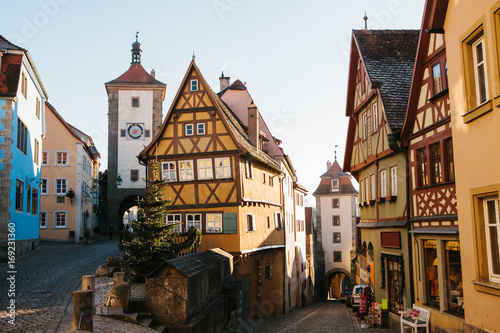 A beautiful street in Rothenburg ob der Tauber with beautiful houses in German style during the Christmas holidays. Christmas Germany without snow. Celebrating Christmas in Europe.