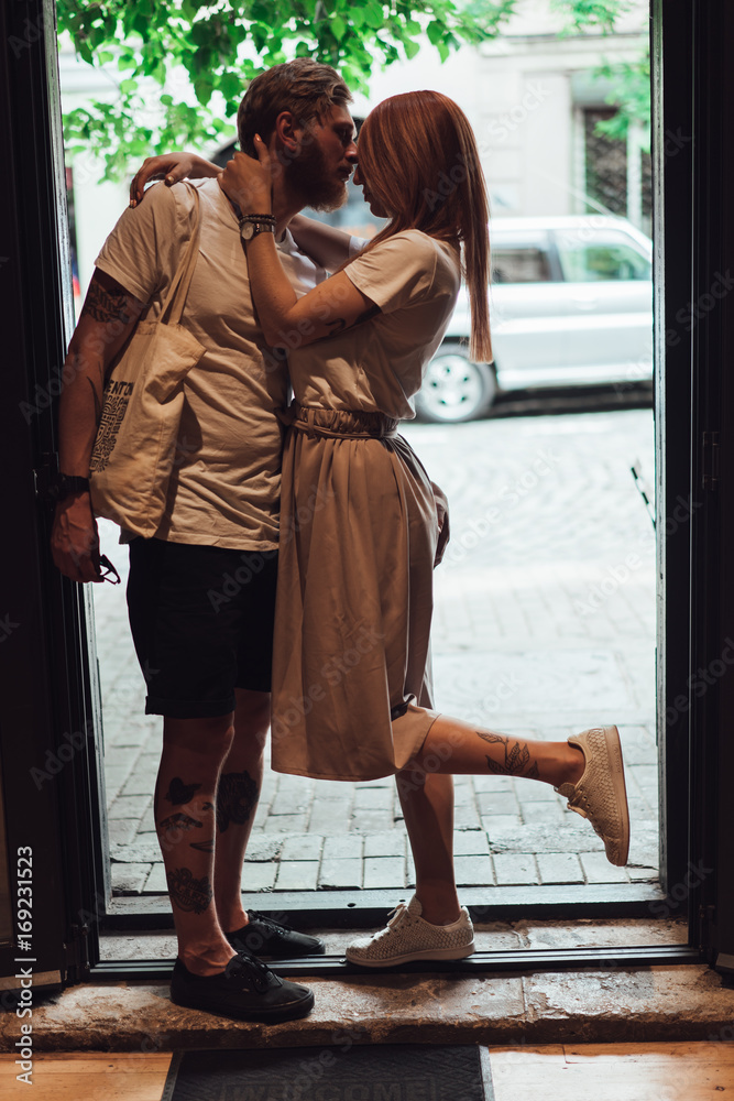 couple posing in the doorway