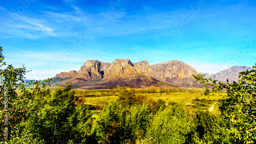 Hottentot-Holland Mountains surrounded by vineyards and farmland in the wine region of Stellenbosch in the Western Cape of South Africa