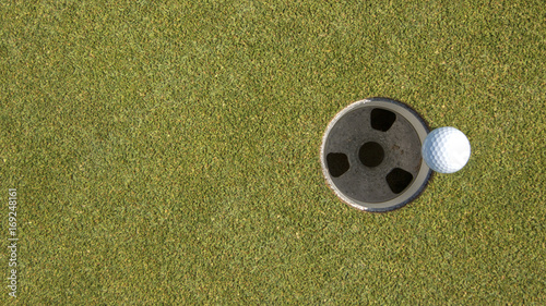 Golf Ball On The Edge Of The Hole