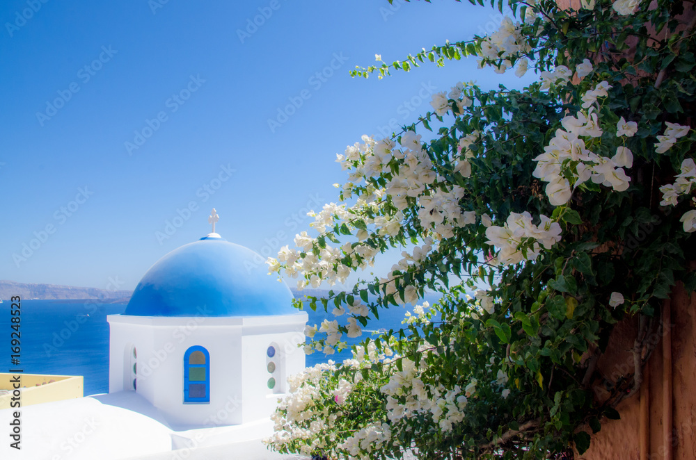 Santorini blue roof church overlooking ocean Cyclades