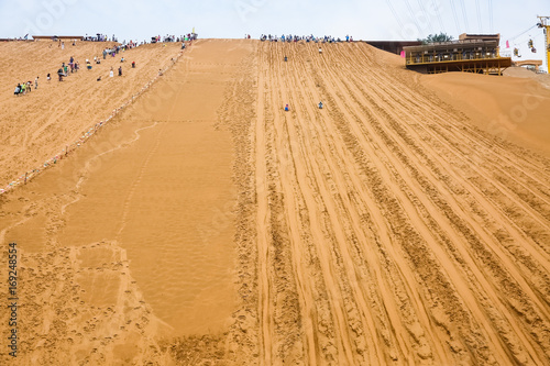 sliding sand, desert tourism background photo