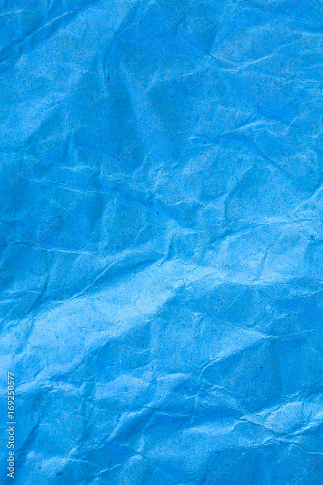 Obraz premium Texture crumpled blue paper background.