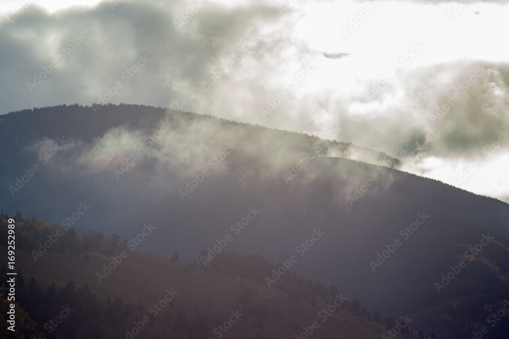 Top of a cloudy mountain during fall in Colorado