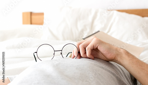 Men hold glasses sleep no bed  with after reading