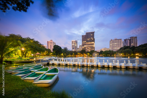 Bangkok Thailand - september 04 2016: evening scene of Bangkok skyline at Lumphini Park in Bangkok. Lumphini Park is a park in Bangkok