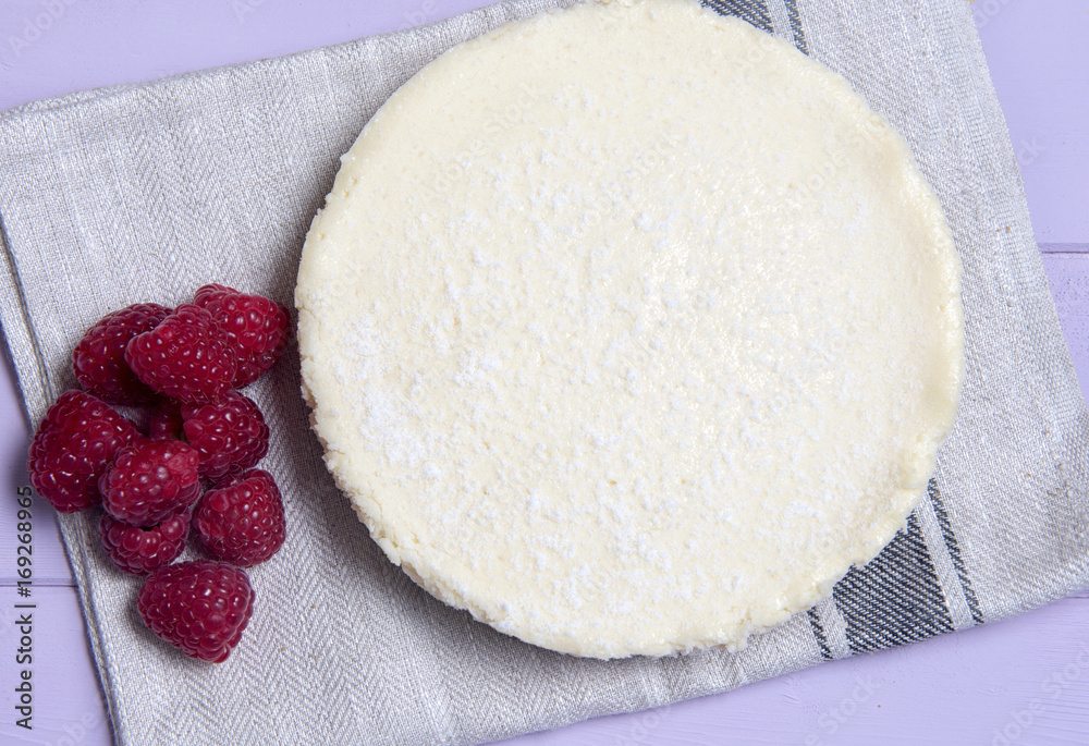Vanilla cheesecake surrounded with raspberries Vanilla cheesecake surrounded with raspberries
