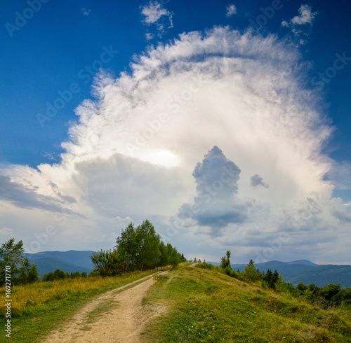 Huge Cumulonimbus cloud over the Carpathian mountains, Ukraine photo