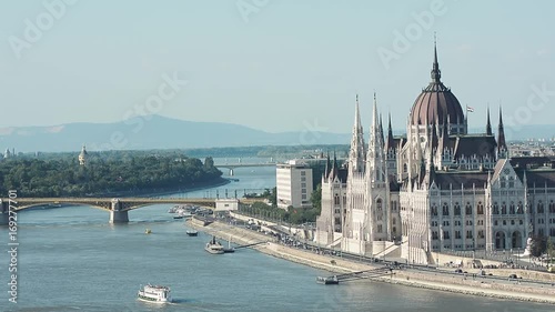 View Of Danube River and Hungarian Parliament Building, the seat of the National Assembly of Hungary, one of Europe's oldest legislative buildings. Budapest, Hungary. photo