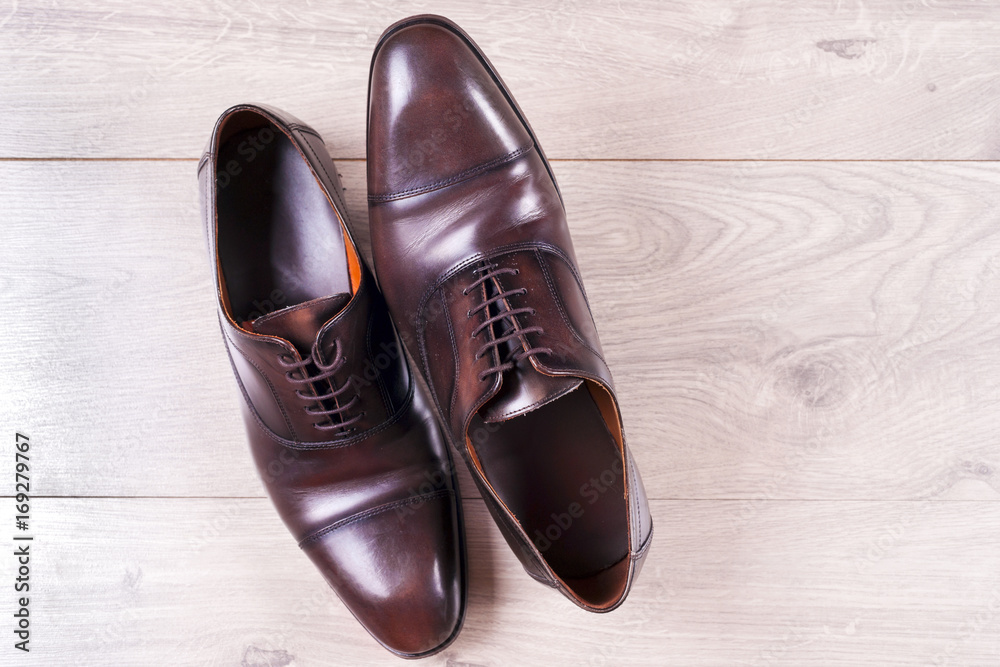 Male fashion with shoes on wooden background. Male fashion with shoes on wooden background.