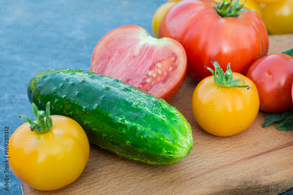 Yellow and red tomatoes on the board Yellow and red tomatoes on the board