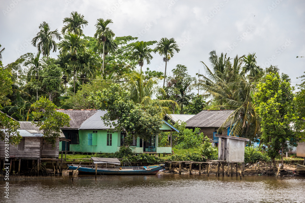 The village riverside in countryside in blue sky The village riverside in countryside in blue sky