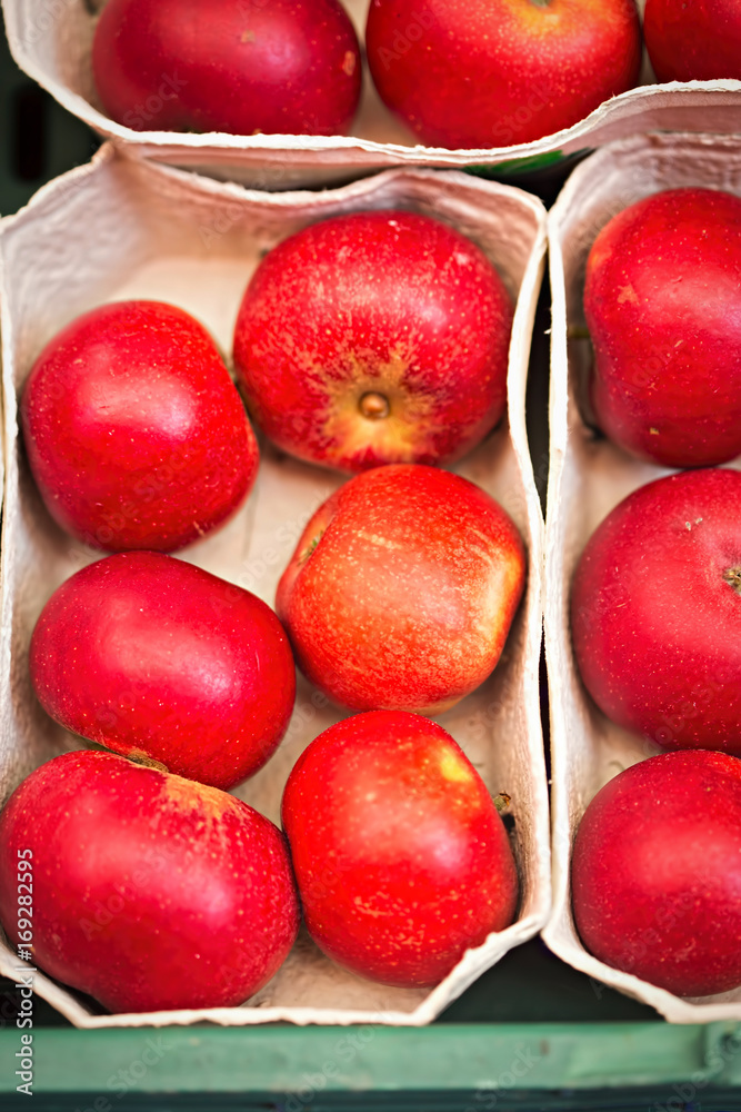 Red apples in paper trays