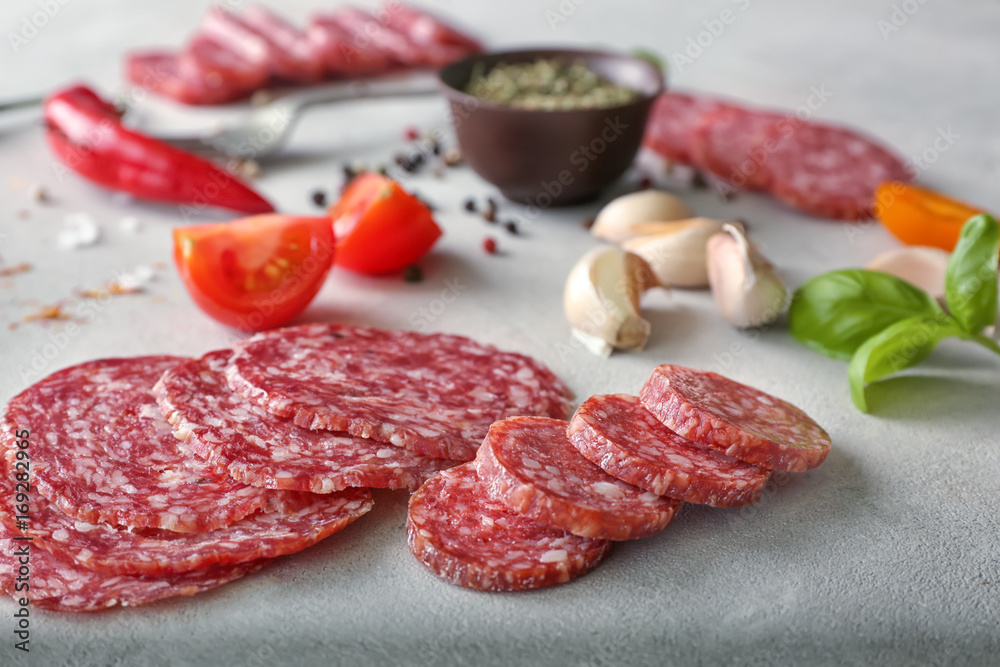 Delicious sliced sausage on table Delicious sliced sausage on table