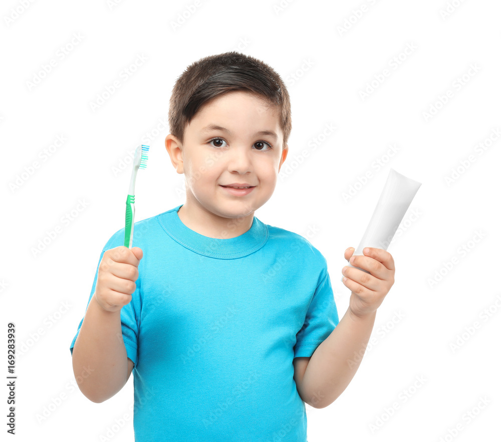 Cute boy with toothbrush and paste on white background. Teeth cleaning concept Cute boy with toothbrush and paste on white background. Teeth cleaning concept