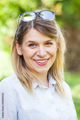 Attractive woman smiling at the camera outdoor