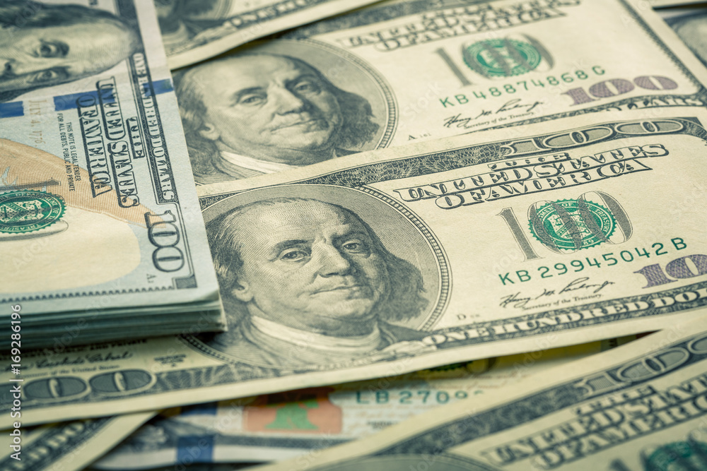 Lot of one hundred dollar bills close-up background Lot of one hundred dollar bills close-up background