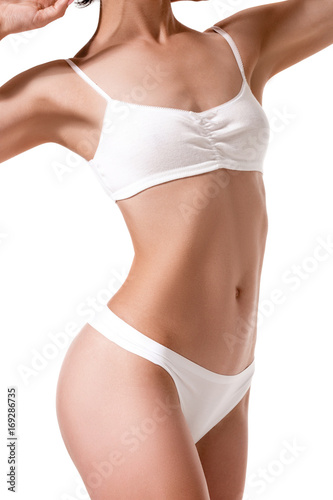Beautiful healthy fit slim female body on white background