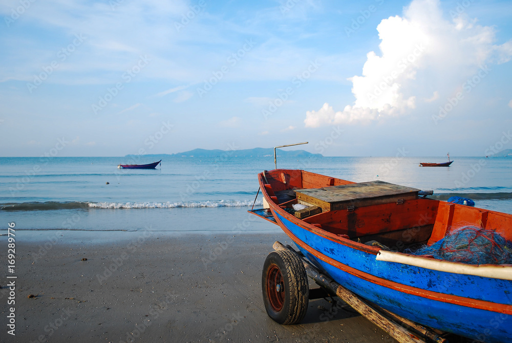 Travel : Thailand summer travel sea with Thai old wood boat at sea beach. Long boat and tropical beach, Andaman Sea, Thailand Travel : Thailand summer travel sea with Thai old wood boat at sea beach. Long boat and tropical beach, Andaman Sea, Thailand