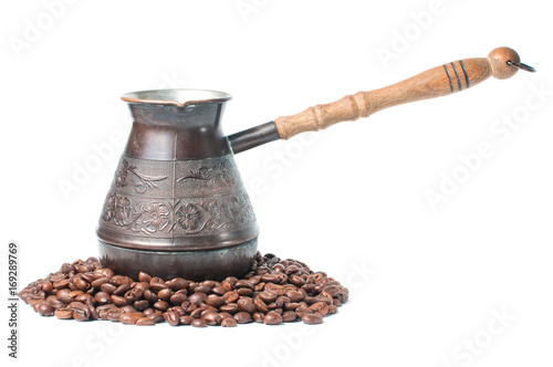 Coffee pot with coffee beans on a white background