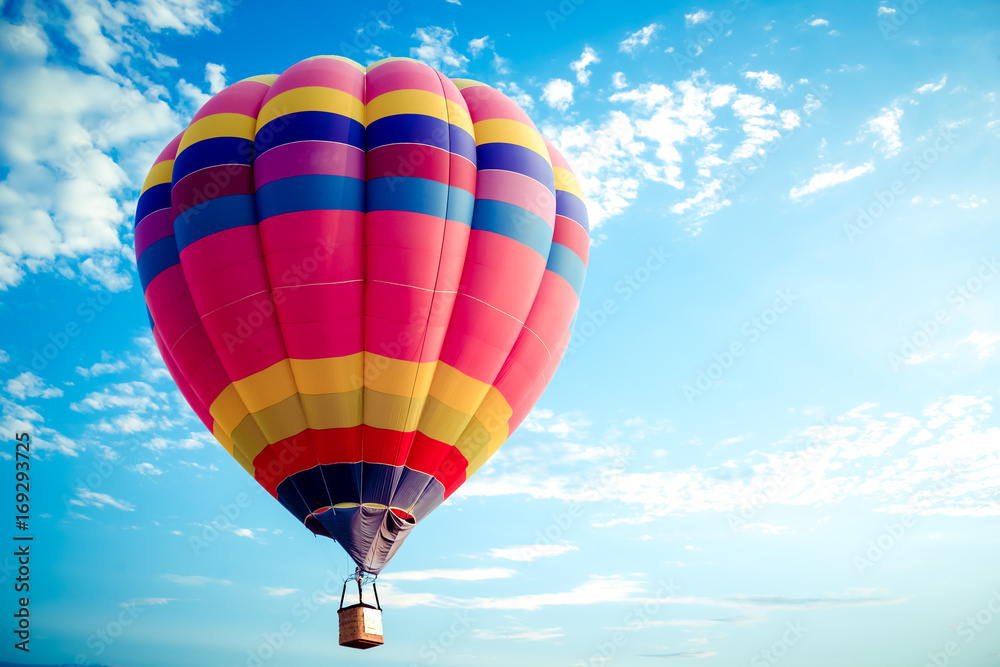 Naklejka premium Colorful hot air balloon flying on sky. travel and air transportation concept - balloon carnival in Thailand