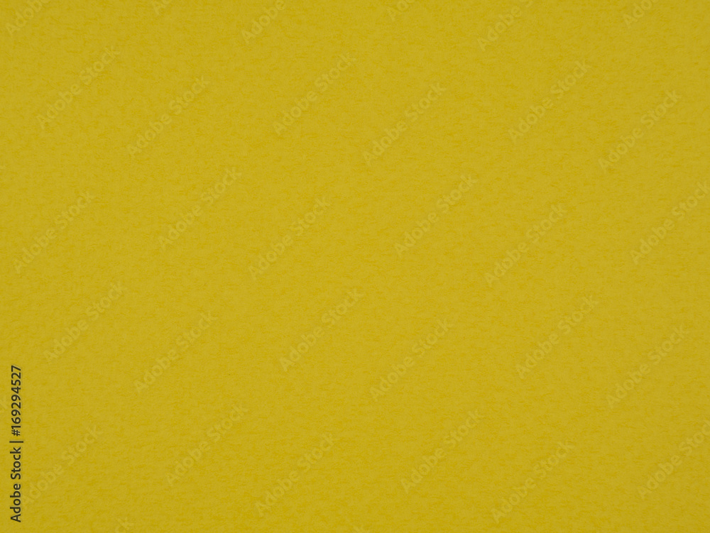 Yellow paper texture. Colored textured cardboard