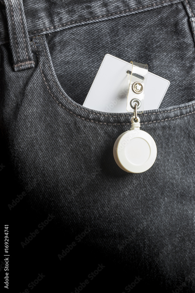 Proximity card in pocket black jeans.