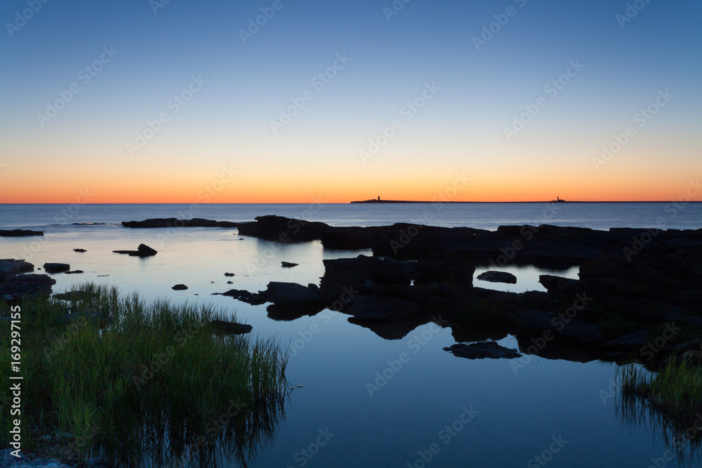 Glowing sea horizon during sunrise. The Island of Gotland in the Baltic Sea.