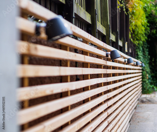Row of spotlights on wooden slats