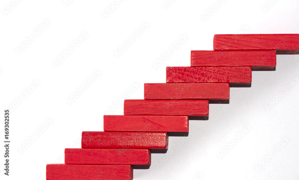 Concept of building success foundation. wooden blocks in the shape of a staircase Concept of building success foundation. wooden blocks in the shape of a staircase