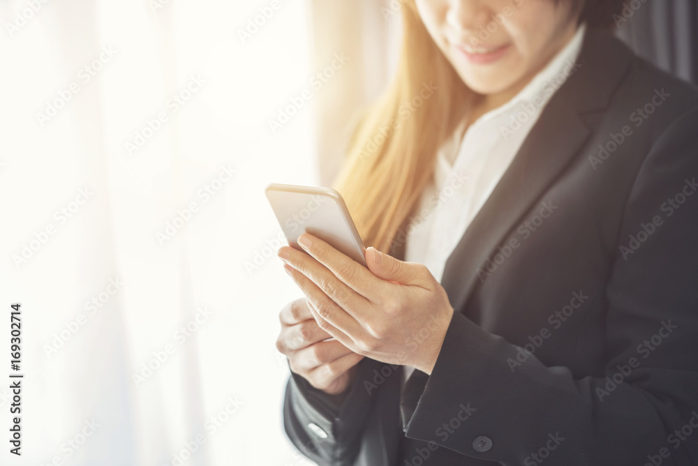 Close up of a business woman using mobile smart phone, copy space. Close up of a business woman using mobile smart phone, copy space.