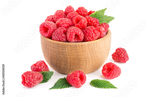 Raspberry in a wooden bowl isolated on a white background