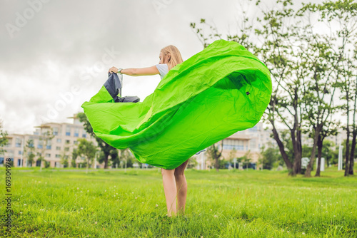 A woman tries to inflate an air sofa photo