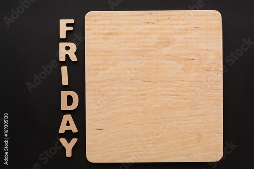 Word Friday with blank wooden board.