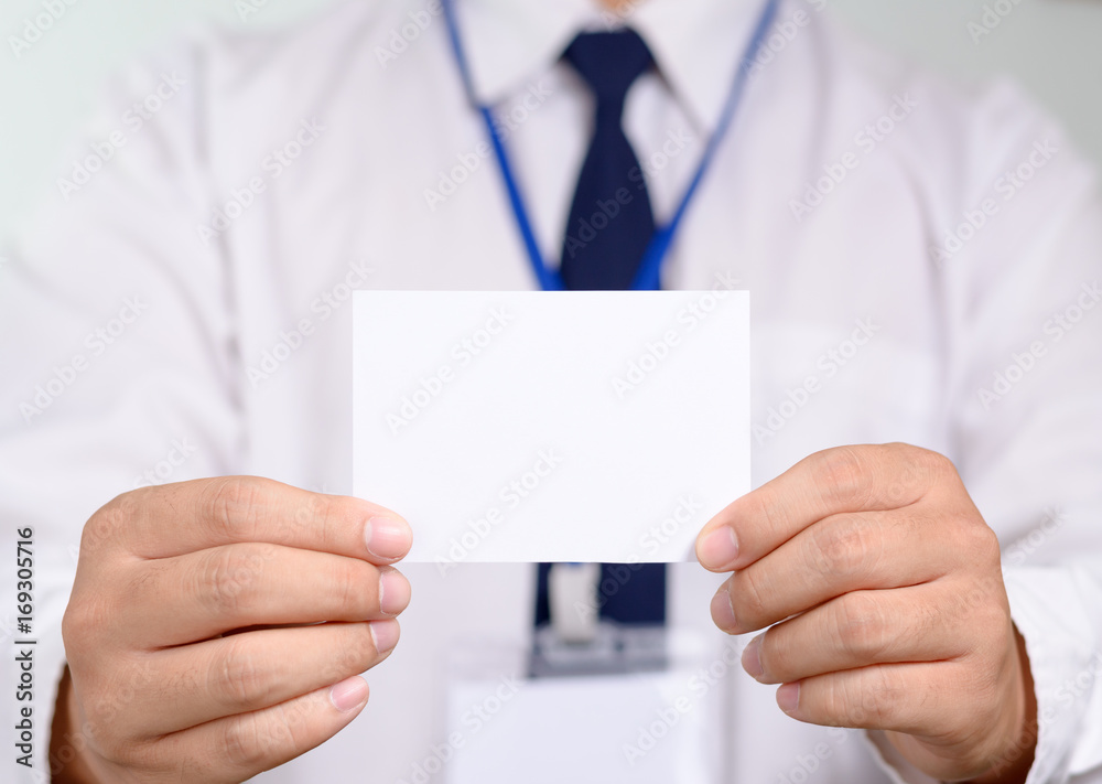 Businessman showing his name card. Businessman showing his name card.