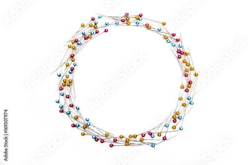Frame of red and blue and yellow push pin on white background.
