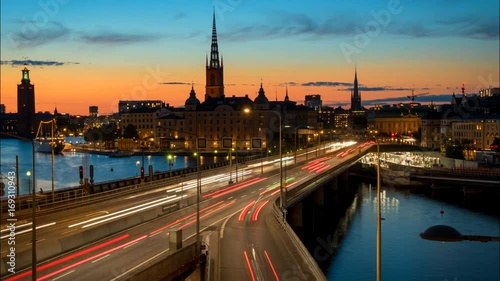 Stockholm, Sweden. Time lapse of Stockholm city center during sunset. Centralbron bridge with traffic photo