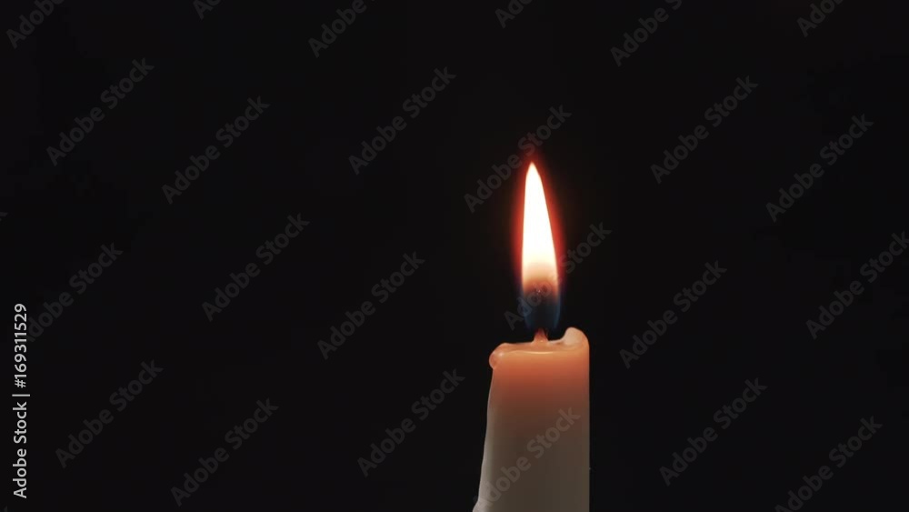 ighting tall candle with another candle in the dark ighting tall candle with another candle in the dark