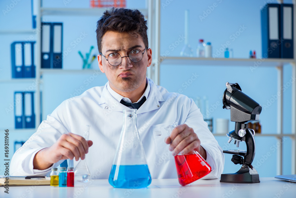 Funny mad chemist working in a laboratory