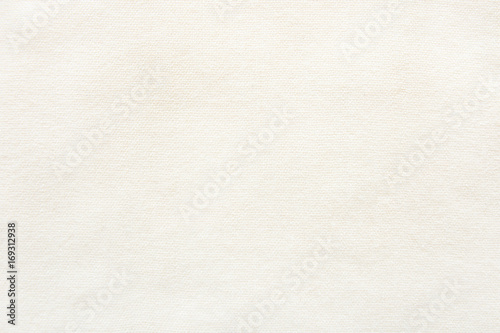 Knitted material background. Shawl texture fabric, top view. photo