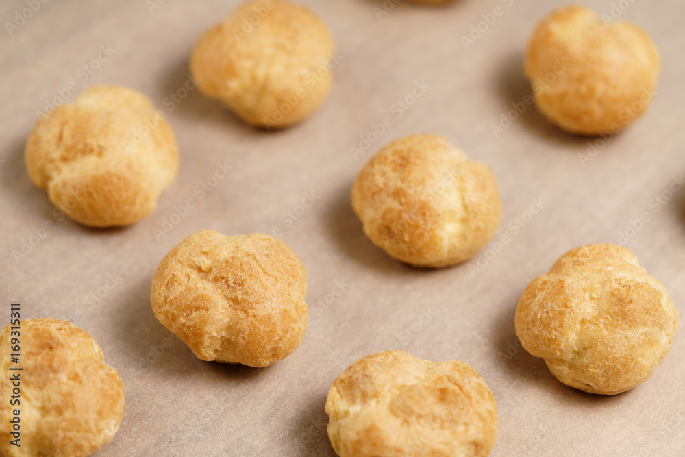 profiteroles on brown paper closeup profiteroles on brown paper closeup