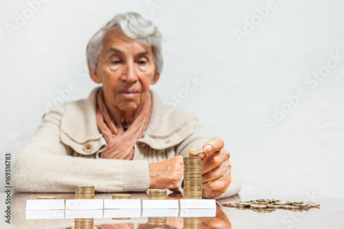 Senior woman saving money or budgeting