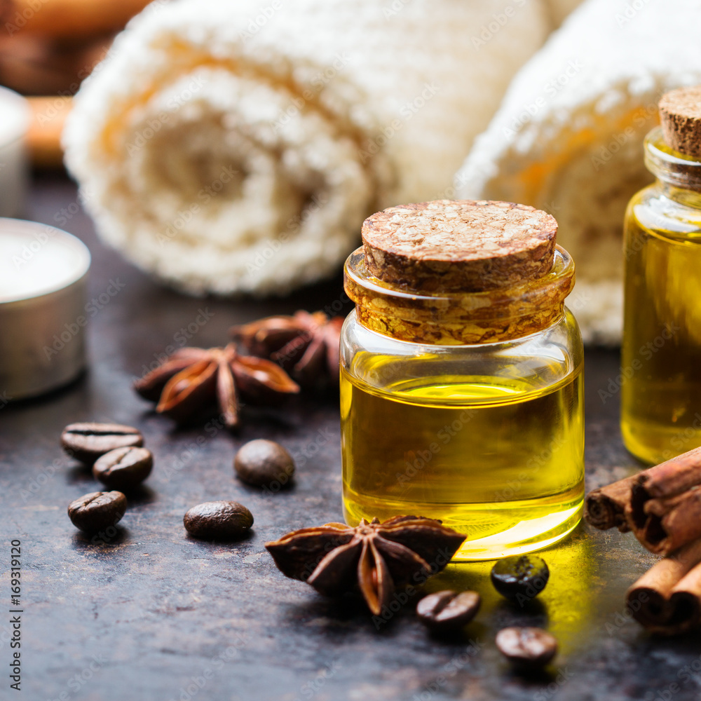 Organic essential oil with coffee spices cinnamon, spa concept Organic essential oil with coffee spices cinnamon, spa concept