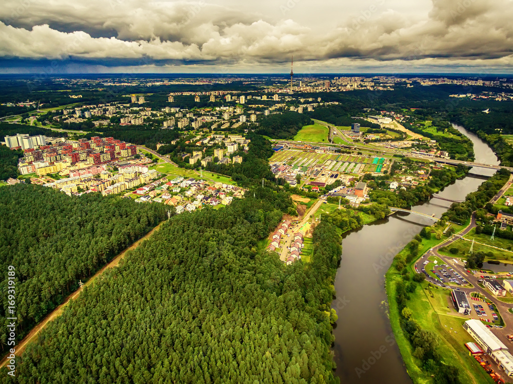 Vilnius, Lithuania: aerial UAV top view of Neris river and park in Bukciai in the summer