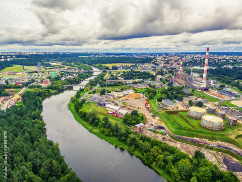 Vilnius, Lithuania: aerial UAV top view of Neris river and industrial area in Vilkpede in the summer