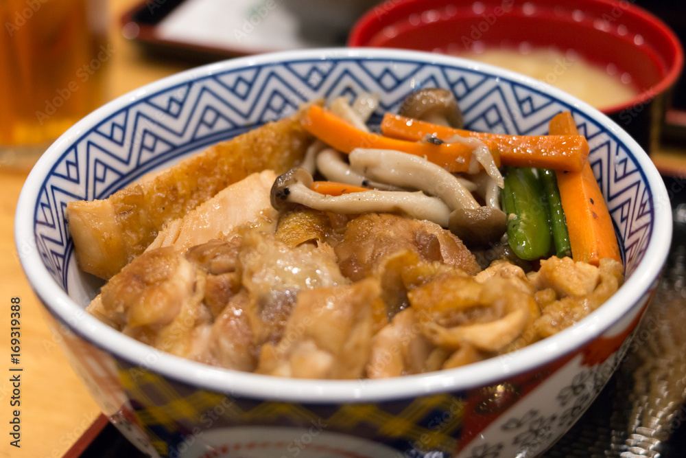 Close up teriyaki chicken fried rice and carrot ,mushroom in the bowl Close up teriyaki chicken fried rice and carrot ,mushroom in the bowl