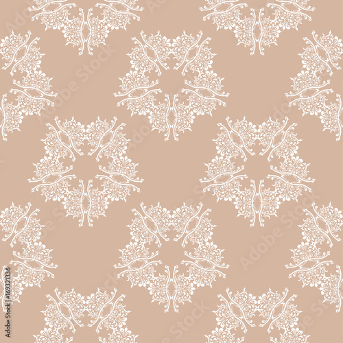 Seamless pattern with brown and white ornaments