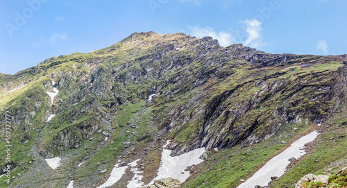 Mountain landscape of the high rocky Fagaras mountains in Carpathians, near the Transfagarasan road and balea lake, Romania