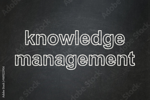 Education concept: Knowledge Management on chalkboard background