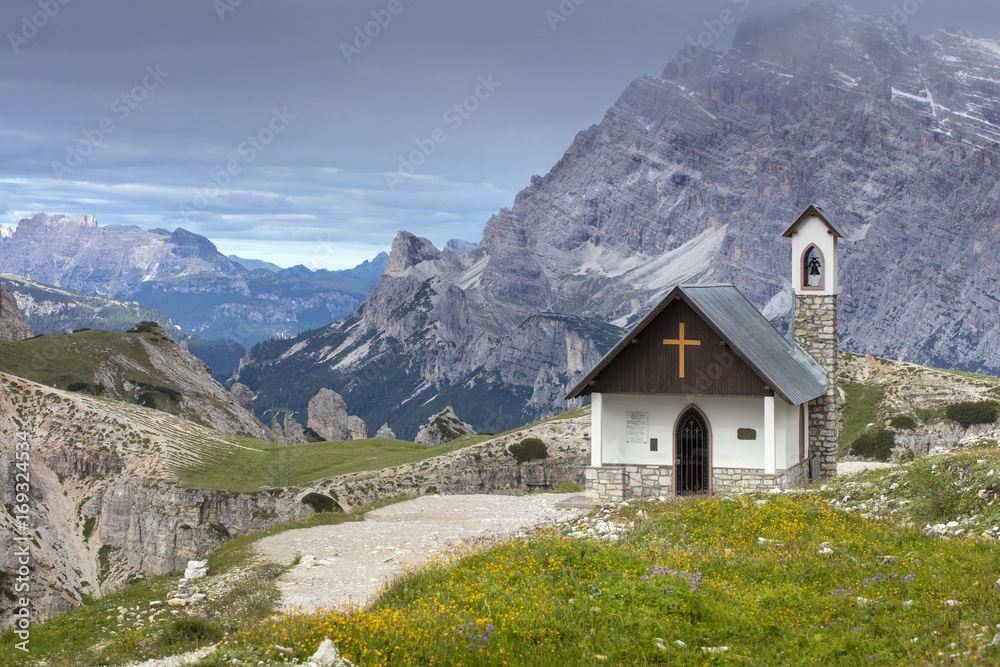 alone church on the path in mountains in Italy